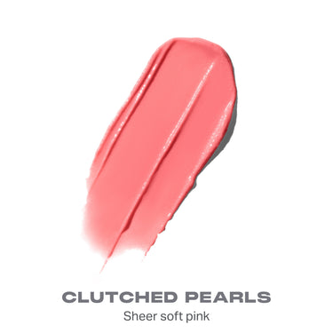 {Clutched Pearls}
Sheer soft pink lip gloss swatch on a white background with 