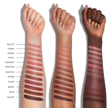 Three arms with different skin tones displaying a range of lipstick swatches on a white background.