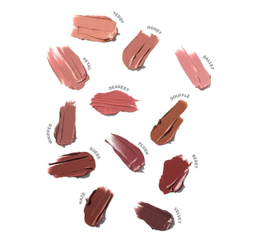 Collection of lipstick swatches in various shades on a white background