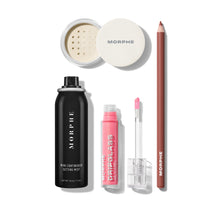 Morphe makeup products including a setting spray, powder, pencil, and lip gloss on a white background.-view-1